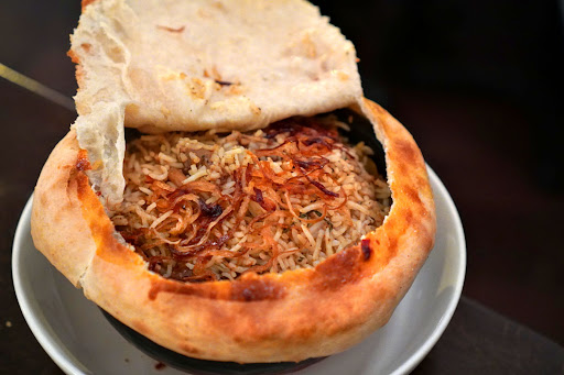 Daru signature dishes Desi-Talian PizzaGoat BiryaniMasala Fried Chicken﻿﻿﻿